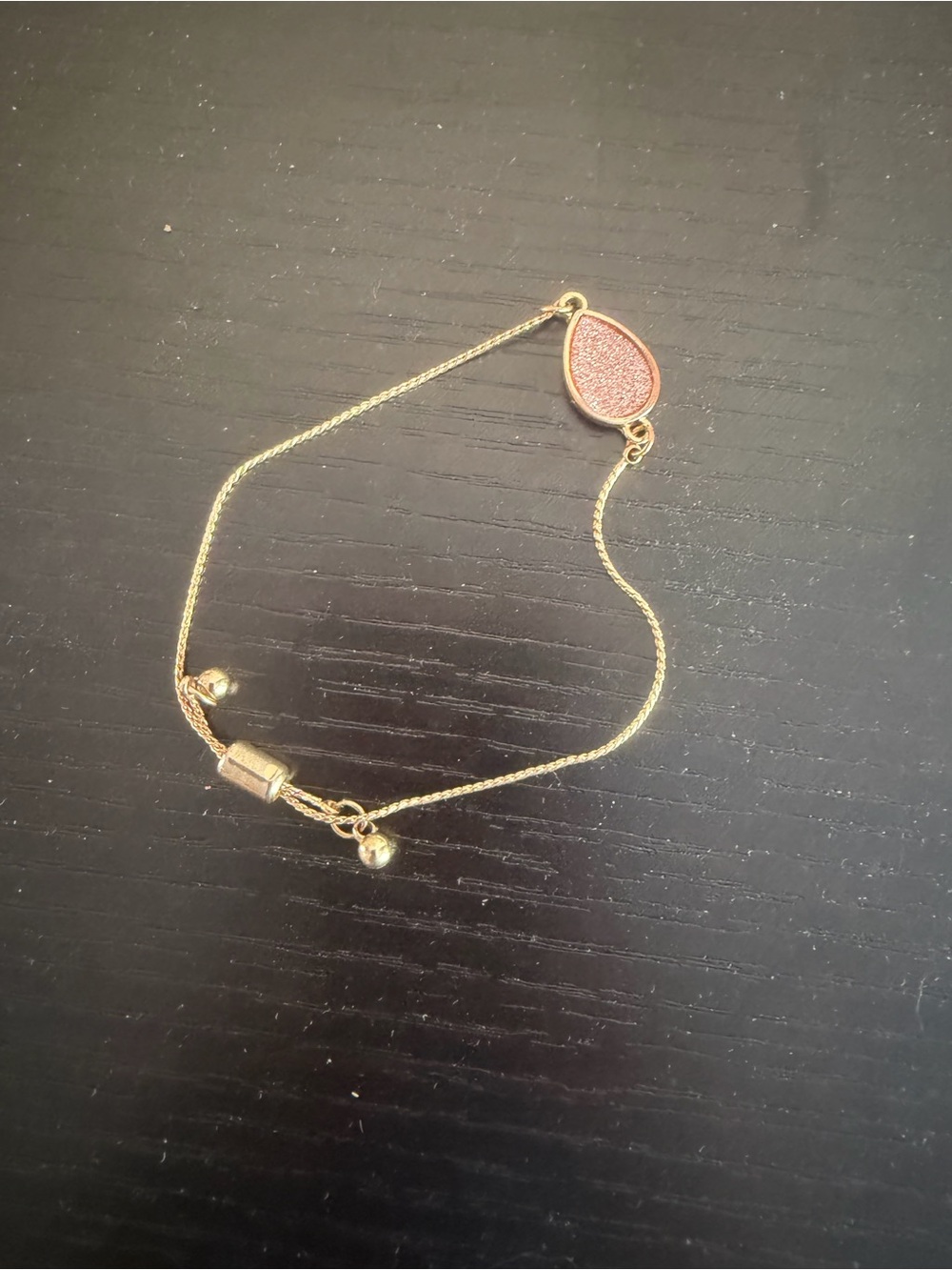 Gold-Tone adjustable Bracelet with Pink Teardrop Accent
